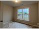 Bright bedroom with a large window that lets in natural light at 2046 Sabra St # Cwo0006, Gastonia, NC 28054