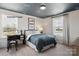 Comfortable bedroom with airplane-themed ceiling, dual windows, and a study desk at 2046 Sabra St # Cwo0006, Gastonia, NC 28054