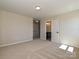 Spacious bedroom with neutral tones, open doorway to the bathroom, and plenty of natural light at 2046 Sabra St # Cwo0006, Gastonia, NC 28054