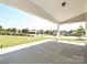 Inviting covered patio with a view of the front yard, perfect for enjoying the outdoors at 2046 Sabra St # Cwo0006, Gastonia, NC 28054