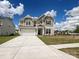 Charming two-story home with a spacious driveway, well-manicured lawn, and inviting curb appeal at 2046 Sabra St # Cwo0006, Gastonia, NC 28054