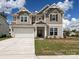 Charming two-story home with a manicured lawn, a two-car garage, and a welcoming front entrance at 2046 Sabra St # Cwo0006, Gastonia, NC 28054