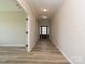 Well-lit foyer with wood floors, leading to various rooms within the home at 2046 Sabra St # Cwo0006, Gastonia, NC 28054