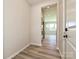 Hallway with wood-look flooring and access to the kitchen and other living spaces at 2046 Sabra St # Cwo0006, Gastonia, NC 28054