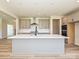 Modern kitchen with a large island, stainless steel appliances, and stylish gray cabinetry at 2046 Sabra St # Cwo0006, Gastonia, NC 28054