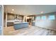 This open kitchen features an island, stainless steel appliances, hardwood floors, and lots of natural light at 2046 Sabra St # Cwo0006, Gastonia, NC 28054