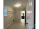 Functional laundry room features a window, shelving, and a view into the bathroom at 2046 Sabra St # Cwo0006, Gastonia, NC 28054
