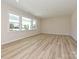 Living room features three large windows that provide natural light at 2046 Sabra St # Cwo0006, Gastonia, NC 28054