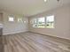 The living room has multiple windows offering view of the yard at 2046 Sabra St # Cwo0006, Gastonia, NC 28054