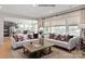 Open concept living room with two white couches, a dining room and kitchen in the background at 2046 Sabra St # Cwo0006, Gastonia, NC 28054