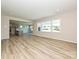 Living room with many windows that provide natural light and views of the outdoor landscape at 2046 Sabra St # Cwo0006, Gastonia, NC 28054