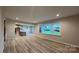 Living space includes an open kitchen with an island, stainless appliances, and hardwood floors at 2046 Sabra St # Cwo0006, Gastonia, NC 28054
