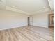 Open bedroom featuring hardwood flooring and an ensuite bathroom and walk-in closet at 2046 Sabra St # Cwo0006, Gastonia, NC 28054