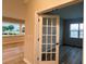 Home office with hardwood floors, windows, and a glass paneled french door at 2046 Sabra St # Cwo0006, Gastonia, NC 28054