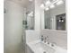Modern bathroom featuring subway tile, glass shower door, and marble countertop at 2432 Hassell Pl, Charlotte, NC 28209