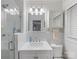 Updated bathroom with glass shower, marble vanity, and decorative lighting at 2432 Hassell Pl, Charlotte, NC 28209