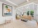Bright living room with coffered ceilings, an archway, and unique wall art at 2432 Hassell Pl, Charlotte, NC 28209