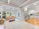 Open-concept living room adjoining the kitchen boasts ample natural light and spacious seating at 2432 Hassell Pl, Charlotte, NC 28209