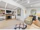 Sunlit living room boasts coffered ceilings, a stone fireplace, and stylish furnishings at 2432 Hassell Pl, Charlotte, NC 28209