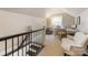 Upstairs office space featuring a desk, chair, and stairs with black handrail at 2432 Hassell Pl, Charlotte, NC 28209
