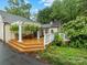 Spacious outdoor patio features potted plants, pergola, and exterior access to interior at 2432 Hassell Pl, Charlotte, NC 28209