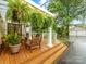 Outdoor patio features potted plants and a pergola at 2432 Hassell Pl, Charlotte, NC 28209