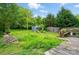 Private backyard with wooden deck, storage shed, and mature trees, perfect for outdoor enjoyment at 2505 Charlotte Hwy, Fort Mill, SC 29707