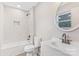 Elegant bathroom with a white vanity, stylish fixtures, and a tiled shower over tub at 2511 Linwood Rd, Gastonia, NC 28052
