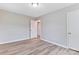 Neutral-toned bedroom with wood-look floors and walk-in closet with convenient interior access at 2511 Linwood Rd, Gastonia, NC 28052
