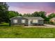 Charming single-story home featuring a brick facade, white trim, and a well-manicured lawn at 2511 Linwood Rd, Gastonia, NC 28052