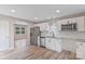 This well-lit kitchen features stainless steel appliances, white cabinets and an open floor plan at 2511 Linwood Rd, Gastonia, NC 28052