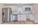 Modern kitchen features stainless steel appliances, white cabinetry, granite countertops, and a stylish backsplash at 2511 Linwood Rd, Gastonia, NC 28052