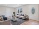 Bright living room with neutral paint, hardwood floors, ample seating, and natural light at 2511 Linwood Rd, Gastonia, NC 28052