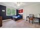 Blue bedroom features desk with chair and large window at 309 Palm Cove Way, York, SC 29745
