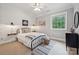 Cozy bedroom features shiplap accent wall and natural light at 309 Palm Cove Way, York, SC 29745