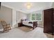 Bedroom with wooden bed and rocking chair at 309 Palm Cove Way, York, SC 29745