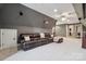 Bonus room features a large seating area with a plush recliner sofa, built in surround sound, and an office nook at 309 Palm Cove Way, York, SC 29745