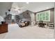 Spacious bonus room featuring recessed lighting, plush carpet, home theater projector and an adjacent home office area at 309 Palm Cove Way, York, SC 29745