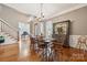 Traditional dining room with hardwood floors, a chandelier, and classic furniture at 309 Palm Cove Way, York, SC 29745