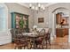Inviting dining room with hardwood floors, arched windows and traditional details at 309 Palm Cove Way, York, SC 29745