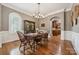 Inviting dining room with a vintage hutch, hardwood floors and traditional details at 309 Palm Cove Way, York, SC 29745