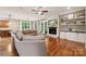 Spacious living room featuring hardwood floors, a stone fireplace, and lots of natural light at 309 Palm Cove Way, York, SC 29745