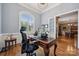 A well-appointed home office with a view and natural light, perfect for productivity at 309 Palm Cove Way, York, SC 29745