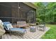 Comfortable screened-in porch with stone tile, a ceiling fan and comfortable seating is perfect for relaxing outdoors at 309 Palm Cove Way, York, SC 29745