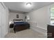 Basement bedroom with cozy carpeting and ample natural light at 327 Wilby Dr, Charlotte, NC 28270