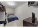 Finished basement bedroom featuring a neutral decor at 327 Wilby Dr, Charlotte, NC 28270