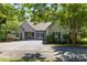 Charming single-story home with manicured landscaping and a spacious driveway at 327 Wilby Dr, Charlotte, NC 28270