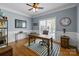 Inviting home office with wood floors, natural light, striped rug, and built-in shelving at 327 Wilby Dr, Charlotte, NC 28270