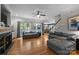 Spacious living room with hardwood floors, a fireplace, and large windows at 327 Wilby Dr, Charlotte, NC 28270
