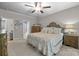 Comfortable bedroom featuring a large bed, wood furniture, and ensuite bath access at 327 Wilby Dr, Charlotte, NC 28270